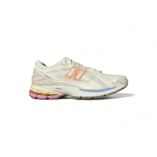 New Balance 1906 sneakers in white with blue and pink